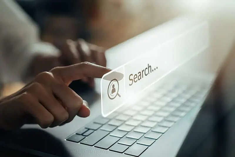 Woman pointing to a floating, virtual search field